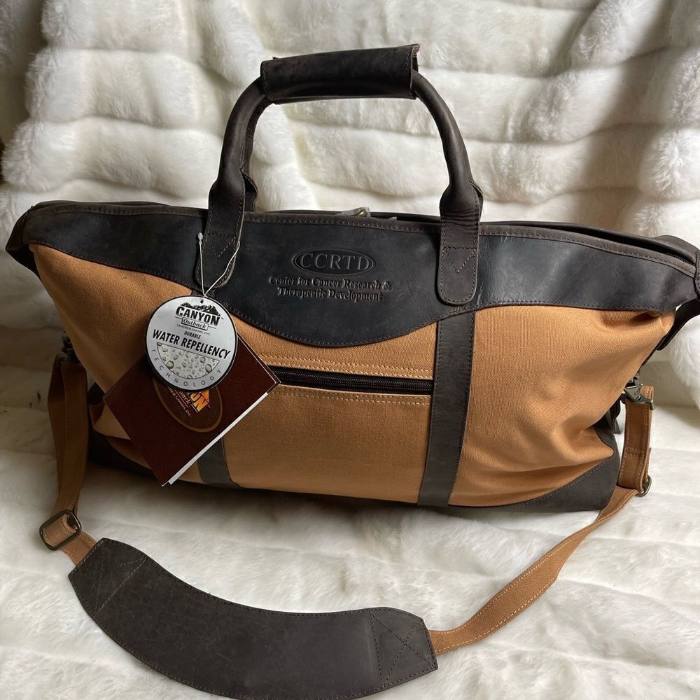 NWT Canyon outback CCRTD embossed logo brown leather and tan canvas duff…